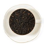 caravan blend tea leaves in white tea cup