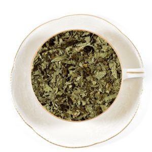 peppermint tea in a white cup and saucer
