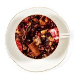 christmas berry tea in a white cup and saucer