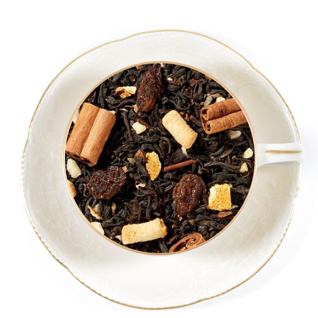 Christmas stollen black tea in a white cup and saucer