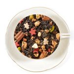magical christmas black tea in a white cup and saucer