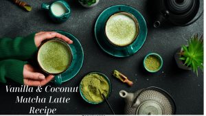 hands cradling a cup of vanilla and coconut matcha latte, surrounded by a ta pot and matcha in a bowl