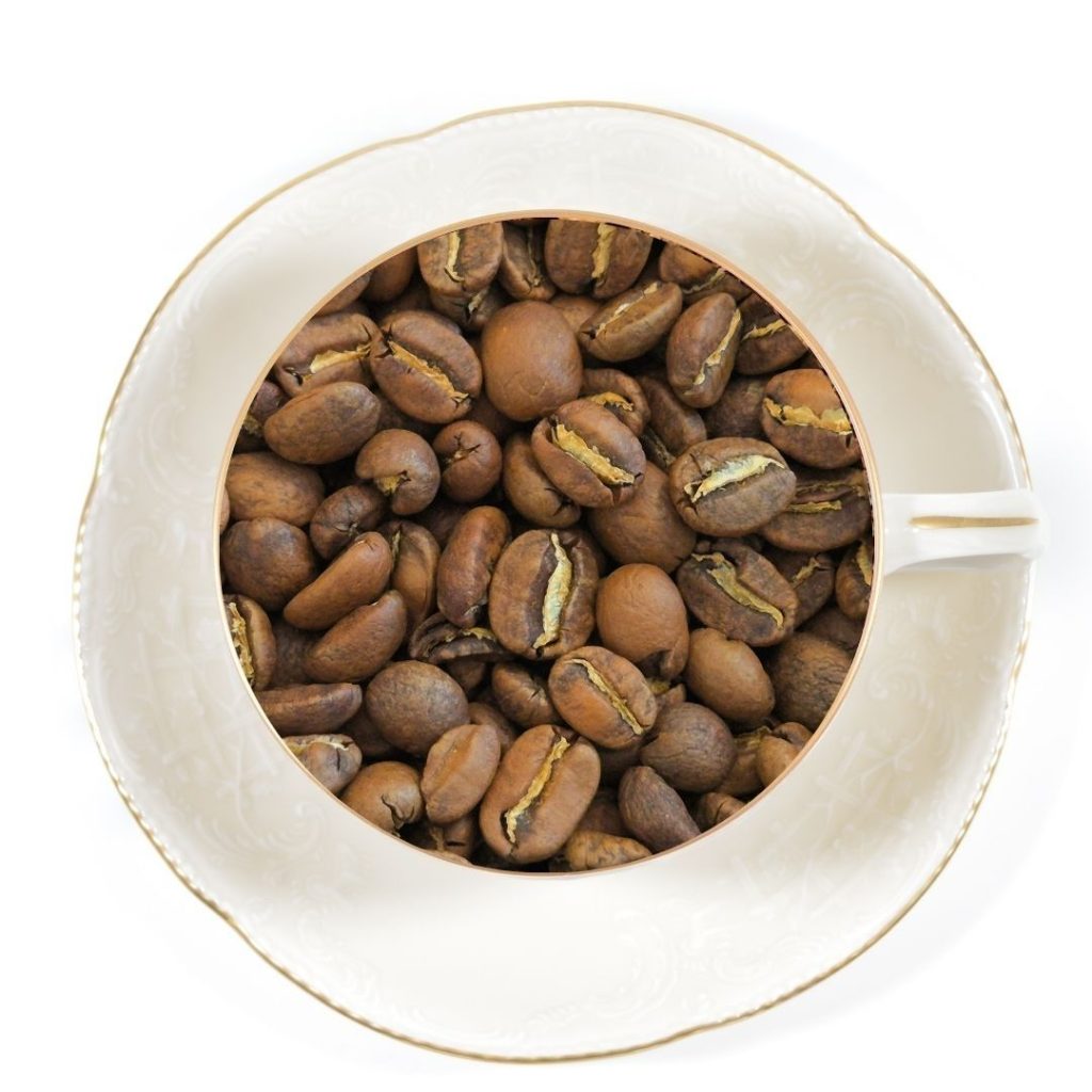 king of the mountain coffee beans in a white cup